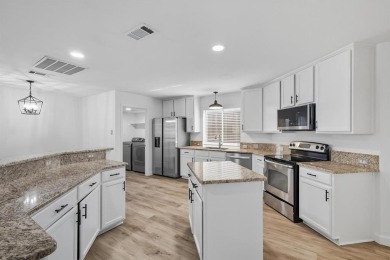 Beautifully updated and move-in ready, this 4-bedroom, 3.5-bath on Stewart Peninsula Golf Course in Texas - for sale on GolfHomes.com, golf home, golf lot