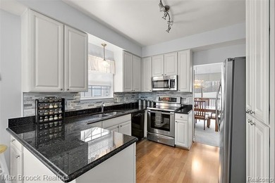 Welcome home to this charming detached colonial-style condo in on The Maples Club in Michigan - for sale on GolfHomes.com, golf home, golf lot