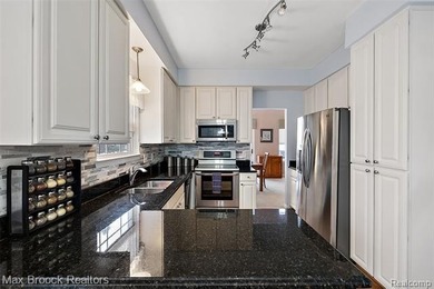 Welcome home to this charming detached colonial-style condo in on The Maples Club in Michigan - for sale on GolfHomes.com, golf home, golf lot