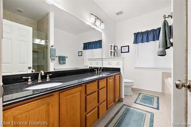 Welcome home to this charming detached colonial-style condo in on The Maples Club in Michigan - for sale on GolfHomes.com, golf home, golf lot