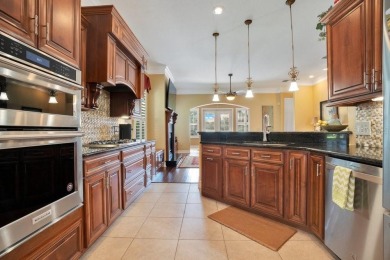 Experience refined living in this exquisitely remodeled on Grasslands Golf and Country Club in Florida - for sale on GolfHomes.com, golf home, golf lot