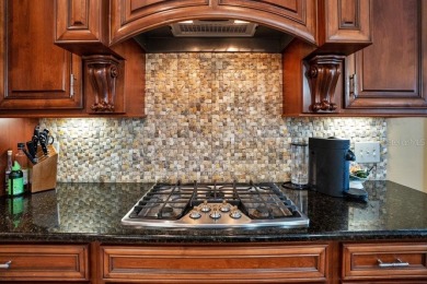 Experience refined living in this exquisitely remodeled on Grasslands Golf and Country Club in Florida - for sale on GolfHomes.com, golf home, golf lot