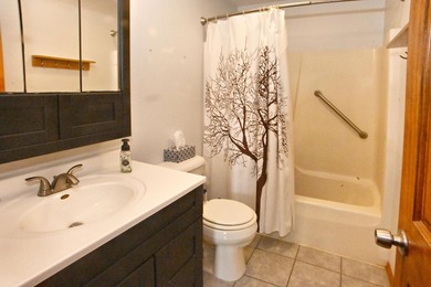 Welcome to this charming ranch home in Lakes of the Four Seasons on Lakes of the Four Seasons Country Club in Indiana - for sale on GolfHomes.com, golf home, golf lot