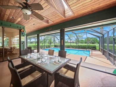 Nestled on a private acre w/majestic golf course views, this on Evergreen Club in Florida - for sale on GolfHomes.com, golf home, golf lot