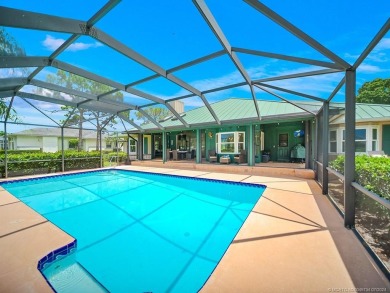 Nestled on a private acre w/majestic golf course views, this on Evergreen Club in Florida - for sale on GolfHomes.com, golf home, golf lot