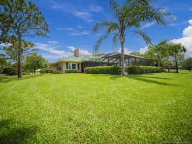 Nestled on a private acre w/majestic golf course views, this on Evergreen Club in Florida - for sale on GolfHomes.com, golf home, golf lot