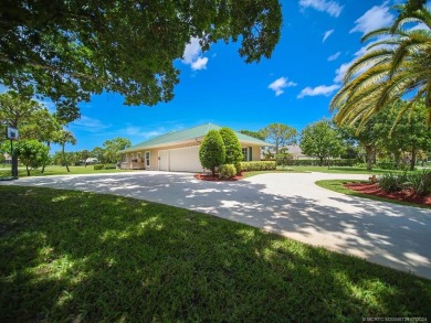 Nestled on a private acre w/majestic golf course views, this on Evergreen Club in Florida - for sale on GolfHomes.com, golf home, golf lot