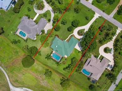 Nestled on a private acre w/majestic golf course views, this on Evergreen Club in Florida - for sale on GolfHomes.com, golf home, golf lot