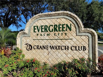 Nestled on a private acre w/majestic golf course views, this on Evergreen Club in Florida - for sale on GolfHomes.com, golf home, golf lot