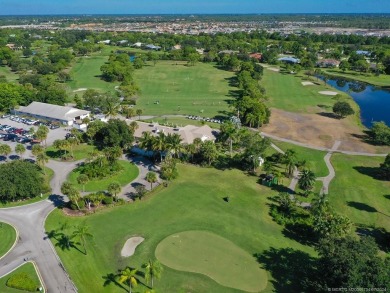 Nestled on a private acre w/majestic golf course views, this on Evergreen Club in Florida - for sale on GolfHomes.com, golf home, golf lot