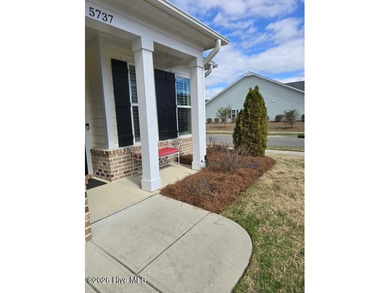 Immaculate 3-bedroom, home with bonus room on a desirable corner on Cape Fear National At Brunswick Forest in North Carolina - for sale on GolfHomes.com, golf home, golf lot