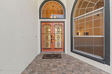 Welcome home to this beautiful Lindhorst-built pool home on Glen Lakes Country Club in Florida - for sale on GolfHomes.com, golf home, golf lot