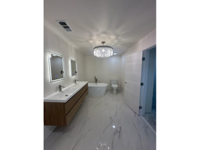 TURNKEY3-bed/3-bath CBS block home on a rare 1-acre lot with on Evergreen Club in Florida - for sale on GolfHomes.com, golf home, golf lot