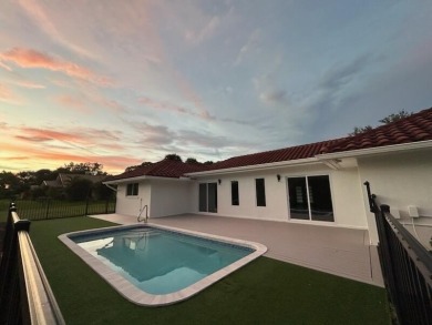 TURNKEY3-bed/3-bath CBS block home on a rare 1-acre lot with on Evergreen Club in Florida - for sale on GolfHomes.com, golf home, golf lot