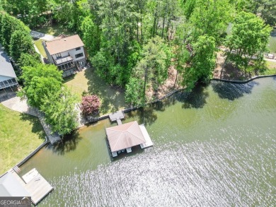 Welcome to this beautifully renovated lakefront home located in on Turtle Cove Golf Course in Georgia - for sale on GolfHomes.com, golf home, golf lot