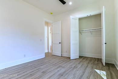 Cradled by the gentle currents where the Shallotte River meets on Lockwood Folly Country Club in North Carolina - for sale on GolfHomes.com, golf home, golf lot