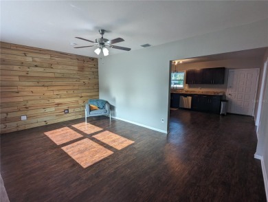 This beautifully maintained three-bedroom, two-bathroom home on The Dunedin Country Club in Florida - for sale on GolfHomes.com, golf home, golf lot