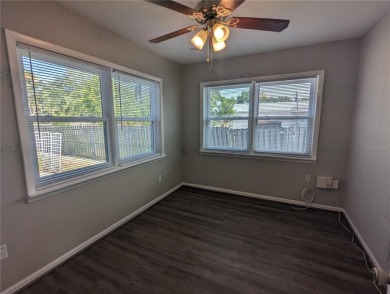 This beautifully maintained three-bedroom, two-bathroom home on The Dunedin Country Club in Florida - for sale on GolfHomes.com, golf home, golf lot