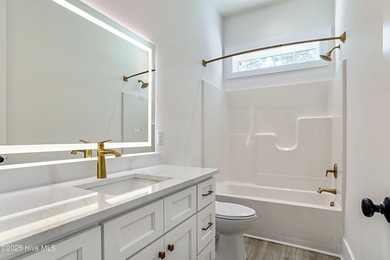 Cradled by the gentle currents where the Shallotte River meets on Lockwood Folly Country Club in North Carolina - for sale on GolfHomes.com, golf home, golf lot