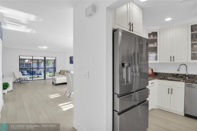 FURNISHED LAKEFRONT CORNER UNIT CONDO in the desirable Cypresses on Boca Lago Golf and Country Club in Florida - for sale on GolfHomes.com, golf home, golf lot