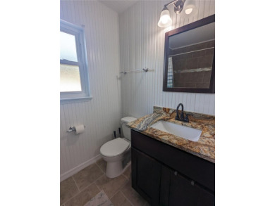 This beautifully maintained three-bedroom, two-bathroom home on The Dunedin Country Club in Florida - for sale on GolfHomes.com, golf home, golf lot