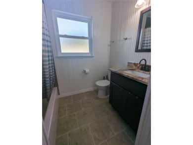 This beautifully maintained three-bedroom, two-bathroom home on The Dunedin Country Club in Florida - for sale on GolfHomes.com, golf home, golf lot