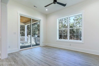 Cradled by the gentle currents where the Shallotte River meets on Lockwood Folly Country Club in North Carolina - for sale on GolfHomes.com, golf home, golf lot