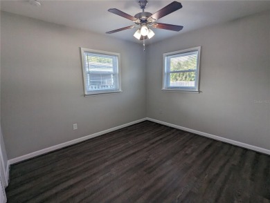 This beautifully maintained three-bedroom, two-bathroom home on The Dunedin Country Club in Florida - for sale on GolfHomes.com, golf home, golf lot