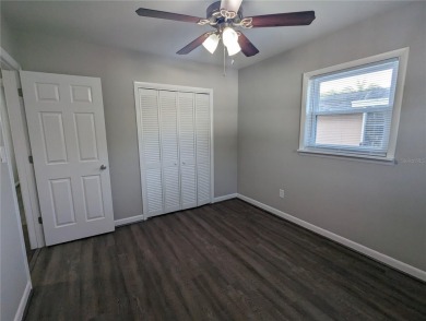 This beautifully maintained three-bedroom, two-bathroom home on The Dunedin Country Club in Florida - for sale on GolfHomes.com, golf home, golf lot