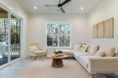 Cradled by the gentle currents where the Shallotte River meets on Lockwood Folly Country Club in North Carolina - for sale on GolfHomes.com, golf home, golf lot