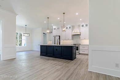 Cradled by the gentle currents where the Shallotte River meets on Lockwood Folly Country Club in North Carolina - for sale on GolfHomes.com, golf home, golf lot