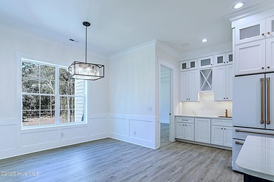 Cradled by the gentle currents where the Shallotte River meets on Lockwood Folly Country Club in North Carolina - for sale on GolfHomes.com, golf home, golf lot