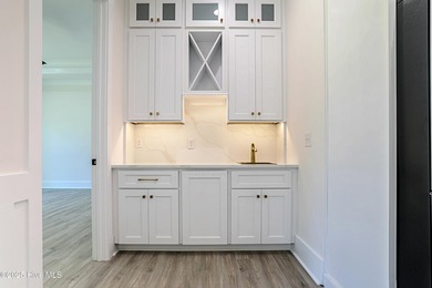 Cradled by the gentle currents where the Shallotte River meets on Lockwood Folly Country Club in North Carolina - for sale on GolfHomes.com, golf home, golf lot