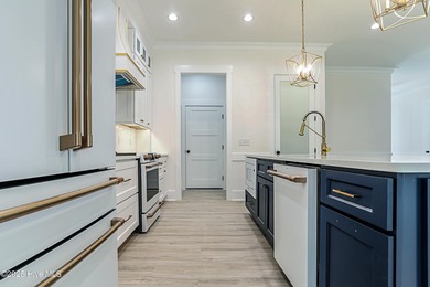 Cradled by the gentle currents where the Shallotte River meets on Lockwood Folly Country Club in North Carolina - for sale on GolfHomes.com, golf home, golf lot