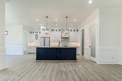 Cradled by the gentle currents where the Shallotte River meets on Lockwood Folly Country Club in North Carolina - for sale on GolfHomes.com, golf home, golf lot