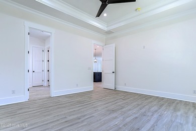 Cradled by the gentle currents where the Shallotte River meets on Lockwood Folly Country Club in North Carolina - for sale on GolfHomes.com, golf home, golf lot