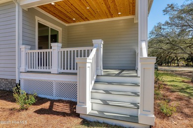 Cradled by the gentle currents where the Shallotte River meets on Lockwood Folly Country Club in North Carolina - for sale on GolfHomes.com, golf home, golf lot