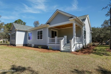 Cradled by the gentle currents where the Shallotte River meets on Lockwood Folly Country Club in North Carolina - for sale on GolfHomes.com, golf home, golf lot