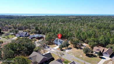 Cradled by the gentle currents where the Shallotte River meets on Lockwood Folly Country Club in North Carolina - for sale on GolfHomes.com, golf home, golf lot