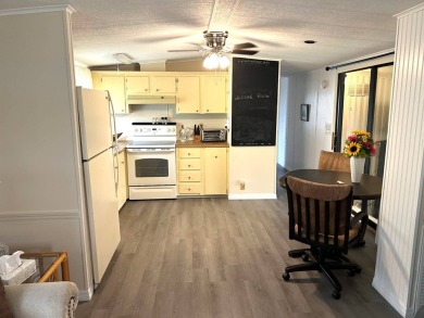 Discover this beautifully updated 2-bedroom, 2-bathroom home on Crystal Lake Club in Florida - for sale on GolfHomes.com, golf home, golf lot