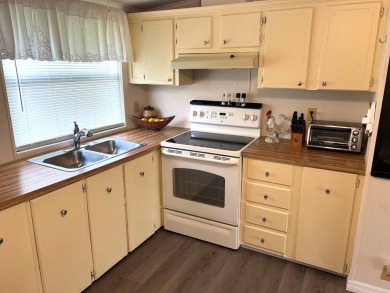 Discover this beautifully updated 2-bedroom, 2-bathroom home on Crystal Lake Club in Florida - for sale on GolfHomes.com, golf home, golf lot