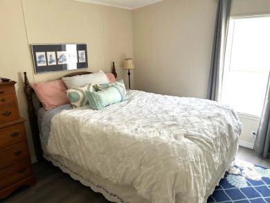 Discover this beautifully updated 2-bedroom, 2-bathroom home on Crystal Lake Club in Florida - for sale on GolfHomes.com, golf home, golf lot