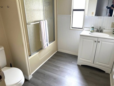 Discover this beautifully updated 2-bedroom, 2-bathroom home on Crystal Lake Club in Florida - for sale on GolfHomes.com, golf home, golf lot