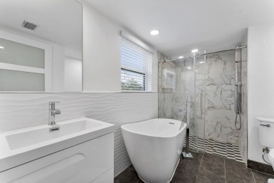 This beautiful modern home has lots of upgrades. It's a true on Ocean Breeze Golf and Country Club in Florida - for sale on GolfHomes.com, golf home, golf lot