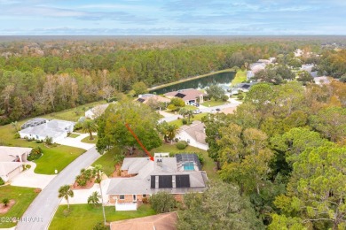 Custom concrete block home located in exclusive Spruce Creek on Spruce Creek Golf Club in Florida - for sale on GolfHomes.com, golf home, golf lot