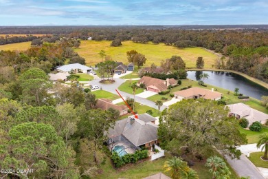 Custom concrete block home located in exclusive Spruce Creek on Spruce Creek Golf Club in Florida - for sale on GolfHomes.com, golf home, golf lot