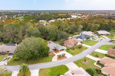 Custom concrete block home located in exclusive Spruce Creek on Spruce Creek Golf Club in Florida - for sale on GolfHomes.com, golf home, golf lot