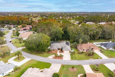 Custom concrete block home located in exclusive Spruce Creek on Spruce Creek Golf Club in Florida - for sale on GolfHomes.com, golf home, golf lot