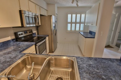 This ONE-STORY GATED townhome is a FABULOUS FIND! It has a great on The Club At Pelican Bay - North Course in Florida - for sale on GolfHomes.com, golf home, golf lot