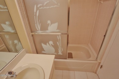 This ONE-STORY GATED townhome is a FABULOUS FIND! It has a great on The Club At Pelican Bay - North Course in Florida - for sale on GolfHomes.com, golf home, golf lot